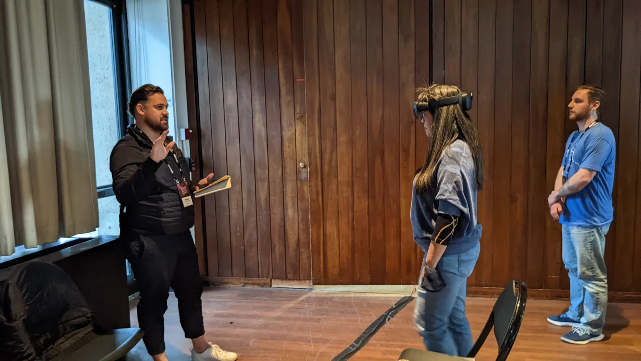Participants demonstrating the LifelinesAR headset experience during MIT Reality Hack.